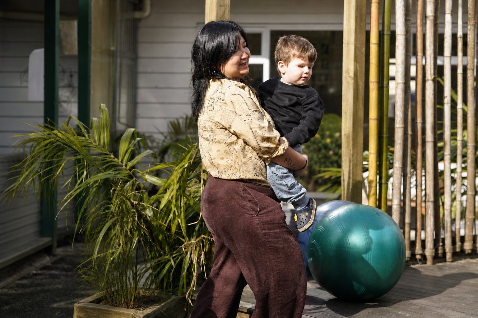 Teacher and child outdoors at Royal Oak